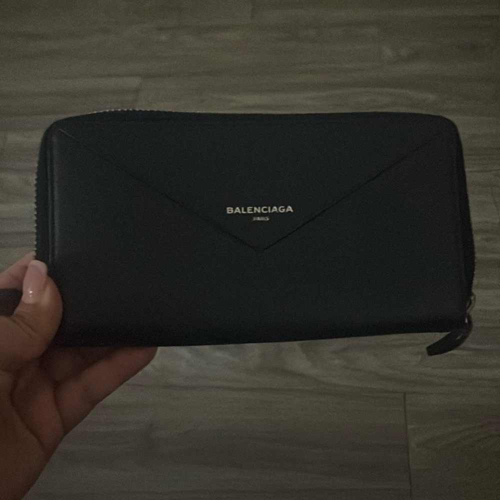 Pre owned Navy Blue Balenciaga Wallet. The wallet has two zippers around it.